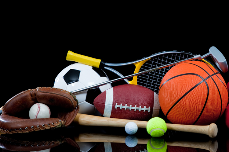 Assortment of sports equipment piled together.