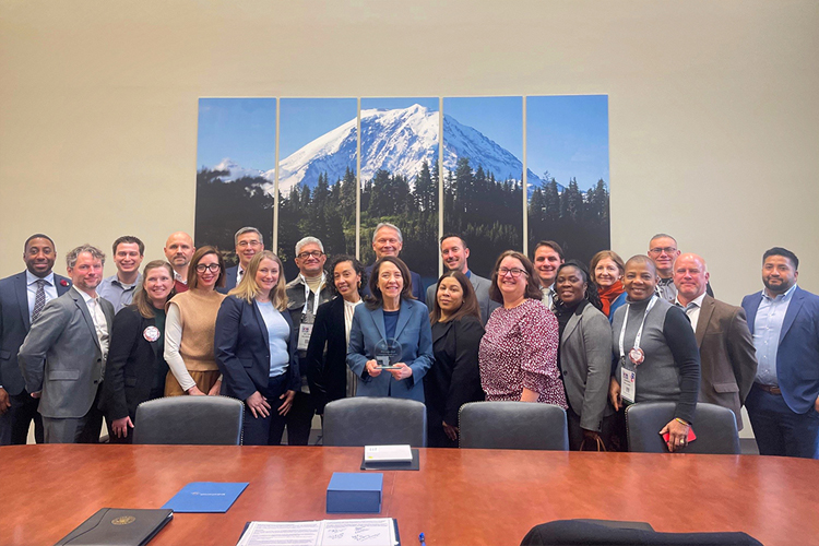 Healthcare leaders, including NOHN CEO Mike Maxwell, MD (back row, center) and Beau Brown (back row, third from left), pose with U.S. Sen. Maria Cantwell (front row, center).